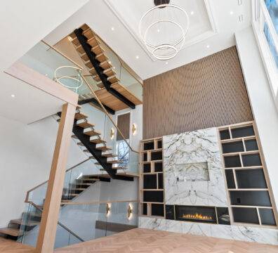 A modern living room with a unique staircase.